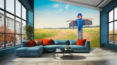 Happy child playing outdoors Wall mural