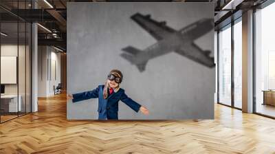 Happy child wants to fly. Imagination, freedom and motivation concept Wall mural