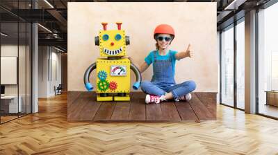 Happy child with toy robot Wall mural