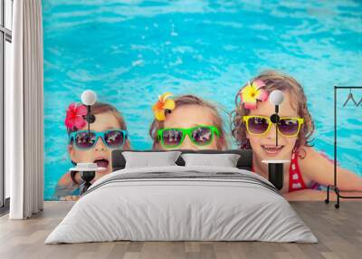 Happy children in the swimming pool Wall mural