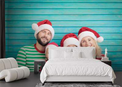 Happy family having fun at Christmas time Wall mural