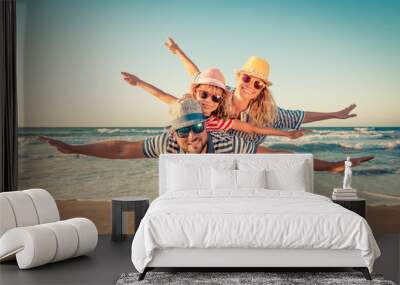 Happy family having fun on summer vacation Wall mural