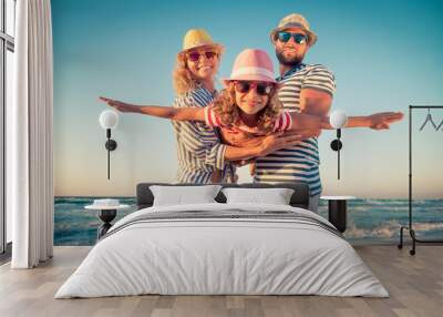 Happy family having fun on summer vacation Wall mural