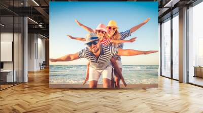 Happy family having fun on summer vacation Wall mural