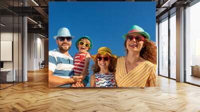 Happy family having fun on summer vacation Wall mural