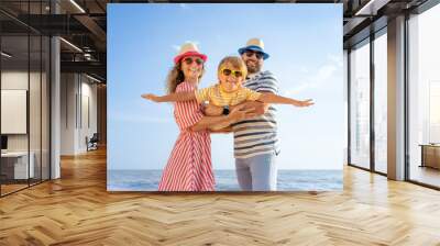 Happy family having fun on summer vacation Wall mural