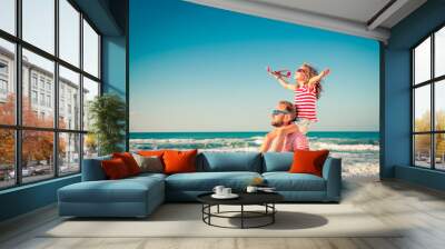 Happy family having fun on summer vacation Wall mural