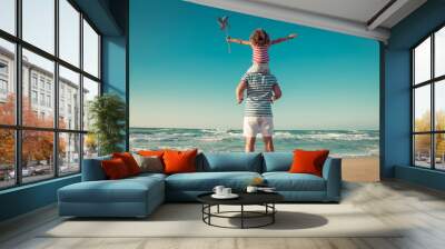 Happy family having fun on summer vacation Wall mural