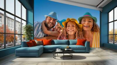 Happy family having fun on summer vacation Wall mural