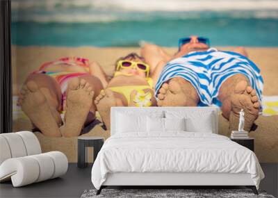 Happy family having fun on the beach Wall mural