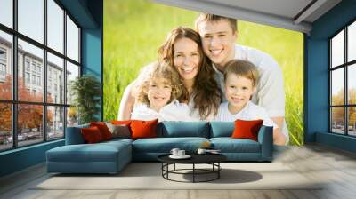 Happy family in spring field Wall mural