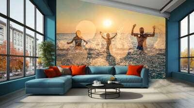 Happy family playing in the sea Wall mural