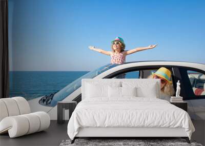 Happy family travel by car on summer vacation Wall mural