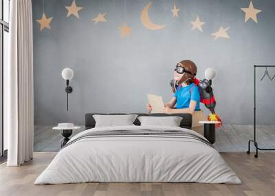 Kid playing with jet pack at home Wall mural