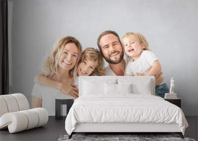 Parents with children having fun at home Wall mural