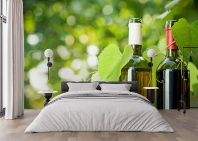 Red and white wine bottles and vine Wall mural