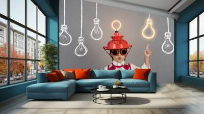 smart child wearing funny helmet with illuminated lightbulb Wall mural