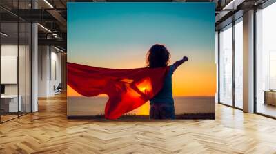 Superhero child on the beach. Summer vacation concept Wall mural