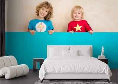 Superheroes children holding blue banner blank Wall mural