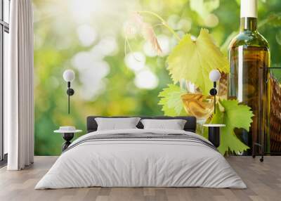 White wine bottle, vine, glass and bunch of grapes Wall mural