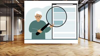 A old man holds a magnifying glass and examines a document, contract or agreement. The concept of a lawyer, businessman, or attorney at work. Wall mural