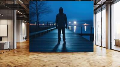 Night city scene with silhouette of dangerous criminal man wearing hood and looking for a victim, illustration for true crime story. Outdoor urban background. Wall mural