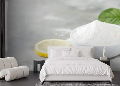 Pile of baking soda near by lemons, non toxic bio cleaner, wide panoramic banner with copy space. Wall mural