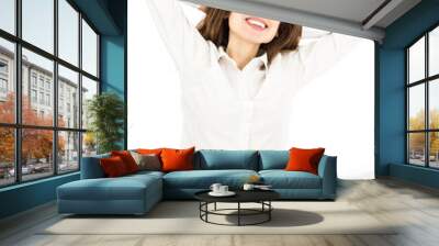 Business woman smiling sitting at her desk Wall mural