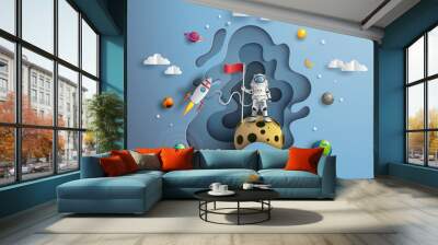 Paper art style of astronaut raising flag on moon with spacecraft, flat-style vector illustration Wall mural