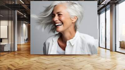 Beautiful senior woman with white hair, laughing and smiling, reflecting health and beauty with great skin and teeth Wall mural