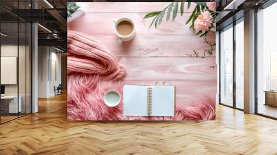 Pink blanket is on a wooden table with a cup of coffee and a notebook. Concept of relaxation and comfort Wall mural