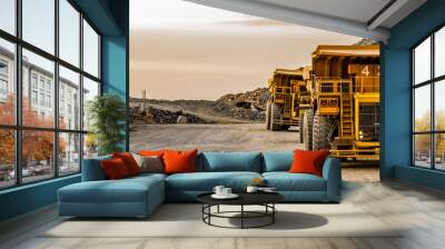 Mining dump trucks transporting Platinum ore for processing Wall mural