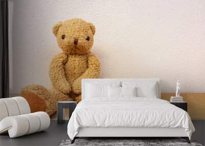 Brown teddy bear sit on the wooden floor. Wall mural