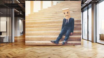 Businessman masked stress on the company stairs. Wall mural