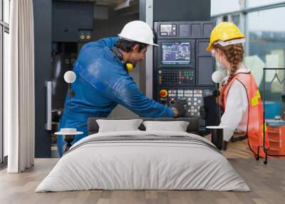 Male engineer teaching female engineer setting command operating control CNC Machinery at factory Industrial Wall mural