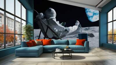 Back view of lunar astronaut opens a beer bottle while resting in a beach chair on Moon surface, enjoying view of Earth Wall mural