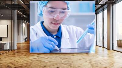 Woman scientist person research writing document science study datum in modern laboratory, professional female doctor working on medical test lab note report health technology development analysis Wall mural