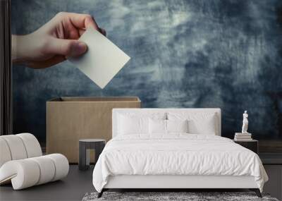 person is carefully placing a white card with a hole in it into a brown cardboard box with a similar hole on top Wall mural