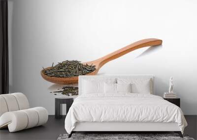 dried green tea leaves whit wooden spoon on a white,isolated Wall mural