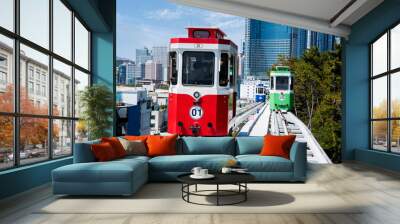 Colorful Sky Capsule train, a landmark seaside railway route, a destination where tourists take a scenic train ride along the seaside in Busan, Korea. Wall mural