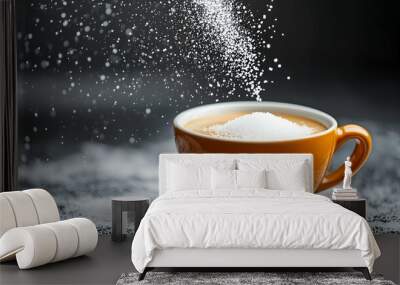 Sugar being sprinkled over a hot cup of coffee in an orange mug. The granules fall gracefully, creating a sweet and warm image perfect for morning routines or beverage-related concepts. Wall mural