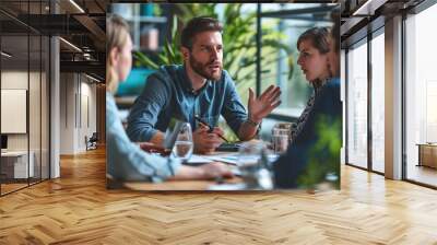 Businessman discussing marketing strategies with a creative team, photographed in high definition. Wall mural