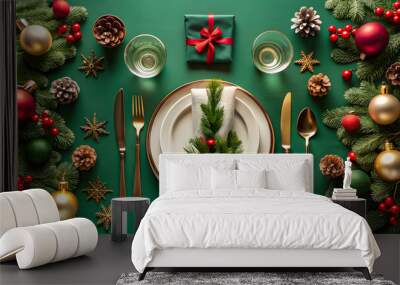 Christmas table setting with red and gold decorations on green background. Wall mural