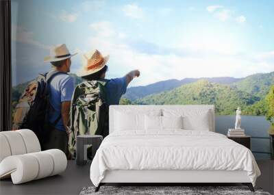 Senior Asian Couple Trekking, traveling, living a happy life in retirement Healthy, can see the fresh nature. The concept of health tourism for the elderly. with copy space. Wall mural