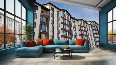 Modern apartment buildings on a sunny day with a blue sky. Facade of a modern European apartment building Wall mural