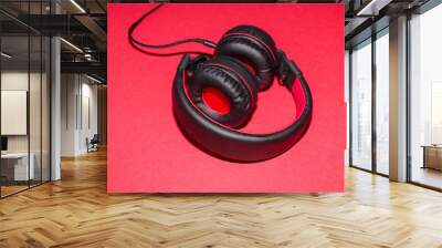 Headphones on pink background Wall mural