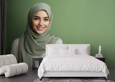 A smiling woman muslim wearing sage green hijab with copy space Wall mural