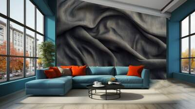 A close-up view of luxurious fabric showcasing intricate folds and textures in a rich dark hue. Wall mural