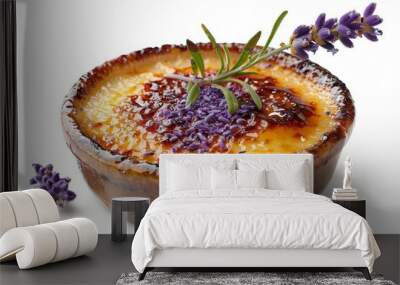 Close-up of a delicious creme brulee dessert topped with lavender flowers and a sprig of rosemary, served in a brown ramekin, white background Wall mural