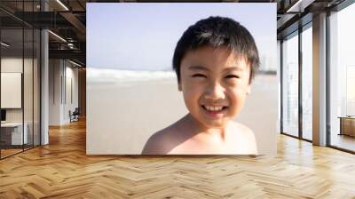 Little boy on the beach for summer holiday Wall mural